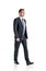 Young ambitious businessman wearing formal suit is walking