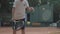 Young ambitious healthy lifestyle, determined tennis player boy concentrating and focusing on game and hitting racket on