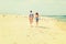 Young American Couple running, relaxing on the beach in New Jersey, USA