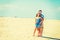 Young American Couple traveling, relaxing on the beach in New Jersey, USA