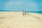 Young American Couple walking, relaxing on the beach in New Jersey, USA