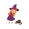 Young angry red-haired girl witch wearing purple dress and hat. Smiling kid character in costume scolds a cat. Trick or