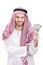 Young Arab businessman holding US dollars