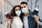 Young Arab Couple Wearing Medical Masks In Airport Holding Passports And Tickets