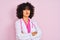 Young arab doctor woman with curly hair wearing stethoscope over isolated pink background skeptic and nervous, disapproving
