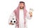 Young Arab holding a football and money