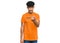 Young arab man wearing tshirt with happiness word message beckoning come here gesture with hand inviting welcoming happy and