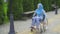 Young arab woman disabled with glasses and traditional scarf in a wheelchair