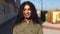 Young Arab woman moving her black curly hair