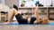 Young arabian mixed race woman lying on the floor on a blue mat practicing sport