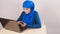 Young arabian woman using laptop