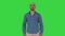 Young arabic man smiling on a Green Screen, Chroma Key.