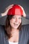 Young architect wearing red hardhat