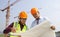 Young architects discussion in front of construction site