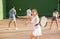 Young Argentinian woman playing frontenis at open-air fronton in summer