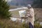 Young artist painting a landscape