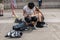 Young artists sketch near their skating equipment in Trafalgar S