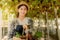 Young Asia farmer woman harvest grape in vineyard with wine bottle wooden basket, healthy organic fruit concept