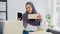 Young Asia muslim businesswoman blogger using mobile phone camera to recording vlog video live streaming review product at home