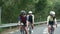 young asian adult cyclist riding bike on rural road