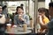 Young asian adults relaxing at outdoor coffee shop