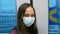 Young Asian American girl wearing surgical mask