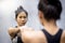 Young asian athletic women in sportswear punching