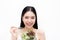 Young Asian beautiful smiling slim woman eating vegetable salad - healthy and diet eating lifestyle concept