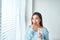 Young asian beauty young woman eating pills and drinking water