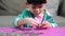 Young Asian boy counting coins for saving money.