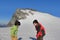 Young asian boys laughing while playing in front of one of the highest peak of mountains in Milford Sound, NZ