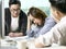 Young asian business woman appearing to be frustrated during a discussion in office