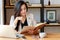 Young Asian business woman working at workplace. beautiful Asian woman in casual suit working with reading book