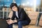 Young Asian businessman sitting in airport terminal