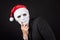 Young Asian businessman wearing white mask and santa hat