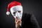 Young Asian businessman wearing white mask and santa hat