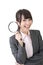 Young asian businesswoman holding magnifying glass