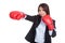 Young Asian businesswoman punch with boxing glove
