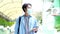 Young asian campus student man wearing protection mask while walking in campus, coronavirus prevention in university, social