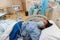 Young Asian Chinese lady in Contraction pain on hospital labour room ward bed waiting to delivery newborn baby
