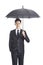 Young asian corporate executive holding a black umbrella