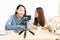 Young Asian couple blogger with recording video.