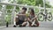 young asian couple looking at cellphone chatting talking during outdoor exercise