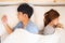 Young asian couple lying separate and failure on bed at home, asia family having problem conflict and divorce