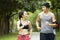 Young asian couple running jogging in a park