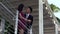 Young asian couple standing and chatting on balcony