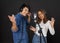 Young asian couples with headphones sing in chorus with microphone and pop filter on tripod stand. Musicians producing music in