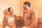 Young Asian couples or lovers have romantic relaxing in sauna room. Skin care heat treatment and body clean up and refreshing in