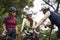 young asian cyclists chatting outdoors