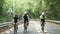 young asian cyclists riding bicycles on rural road